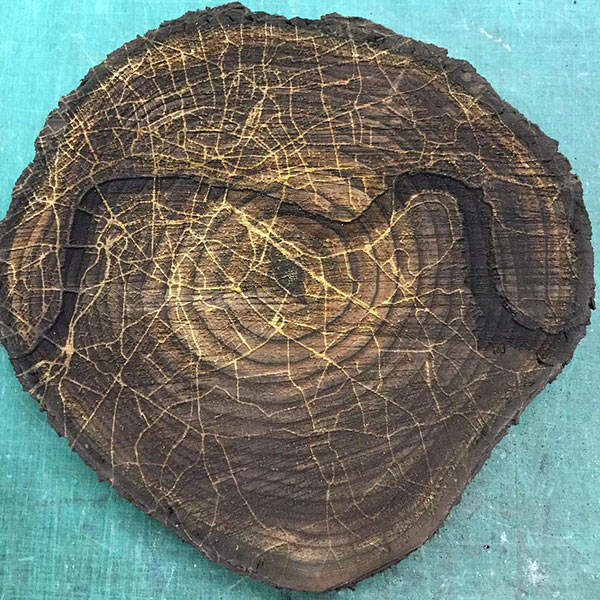 Laser engraved London map into a log