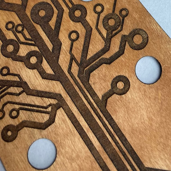Laser engraved plywood guitar headstock cover