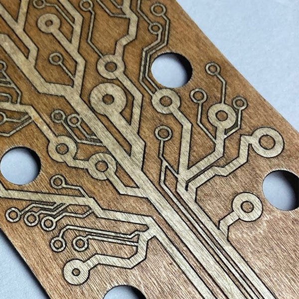 Laser engraved plywood guitar headstock cover