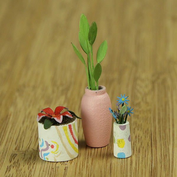 Miniature indoor plants and vase