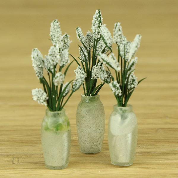 Miniature indoor plants and vase