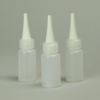 Needle top bottles for application of liquids