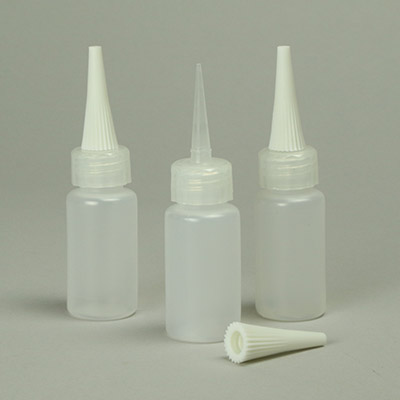 Needle top bottles for application of liquids